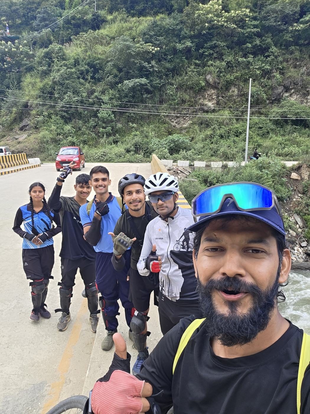 Cycling group selfie on a mountain road