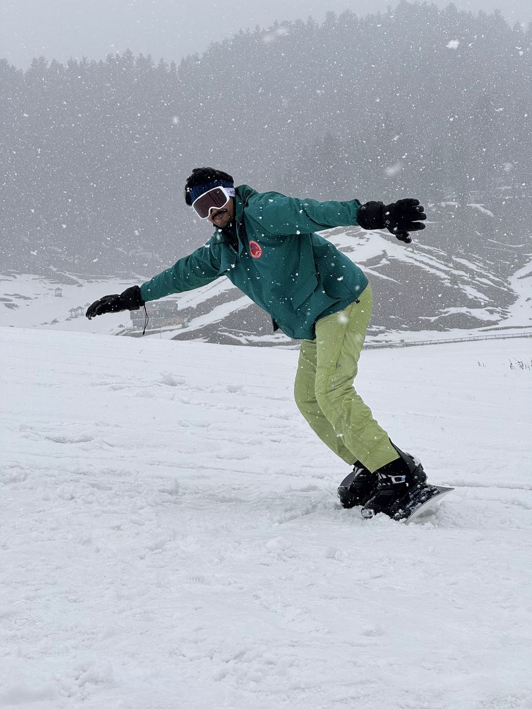 Snowboarding through falling snow