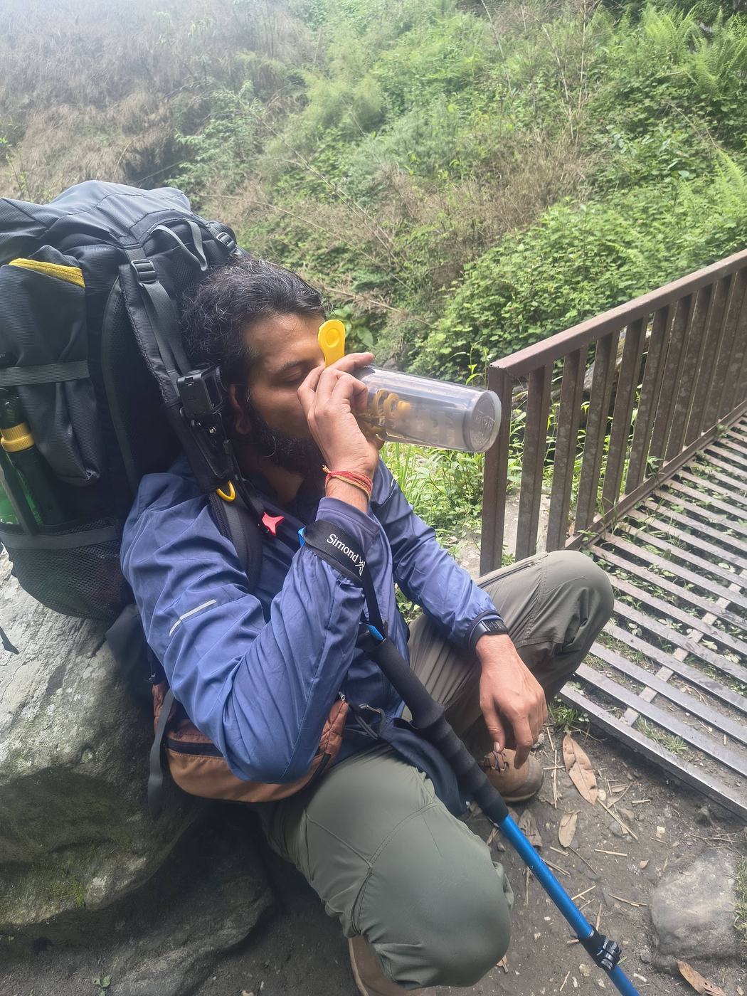 Resting on a trek, drinking water